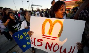 Fast-food workers and their supporters picket outside a Burger King in Los Angeles on August 29, 2013. Photograph: Robyn Beck/AFP